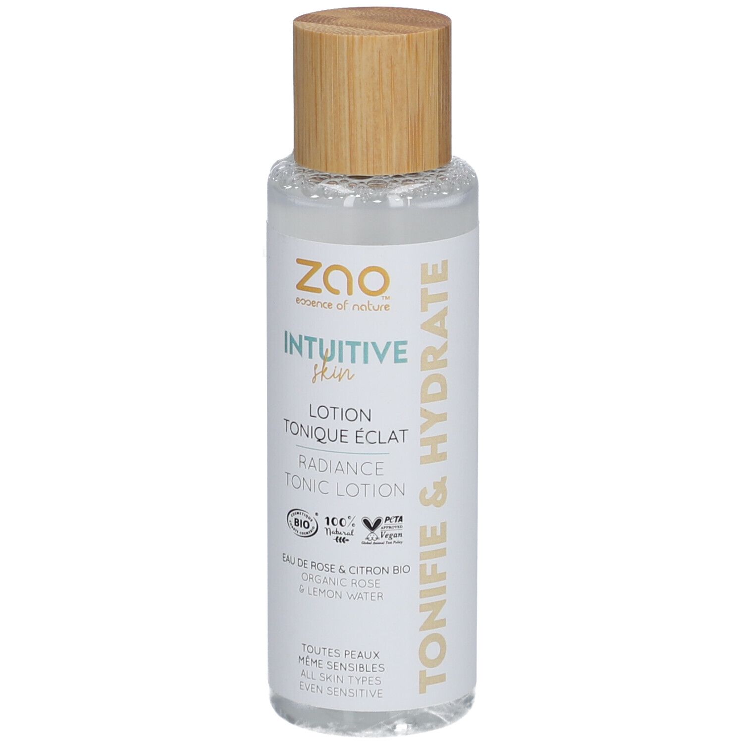 Transparante fles met houten dop. Opschrift: Intuitive Skin, Lotion Tonique Eclat, Radiance Tonic Lotion. Bio-certificering.