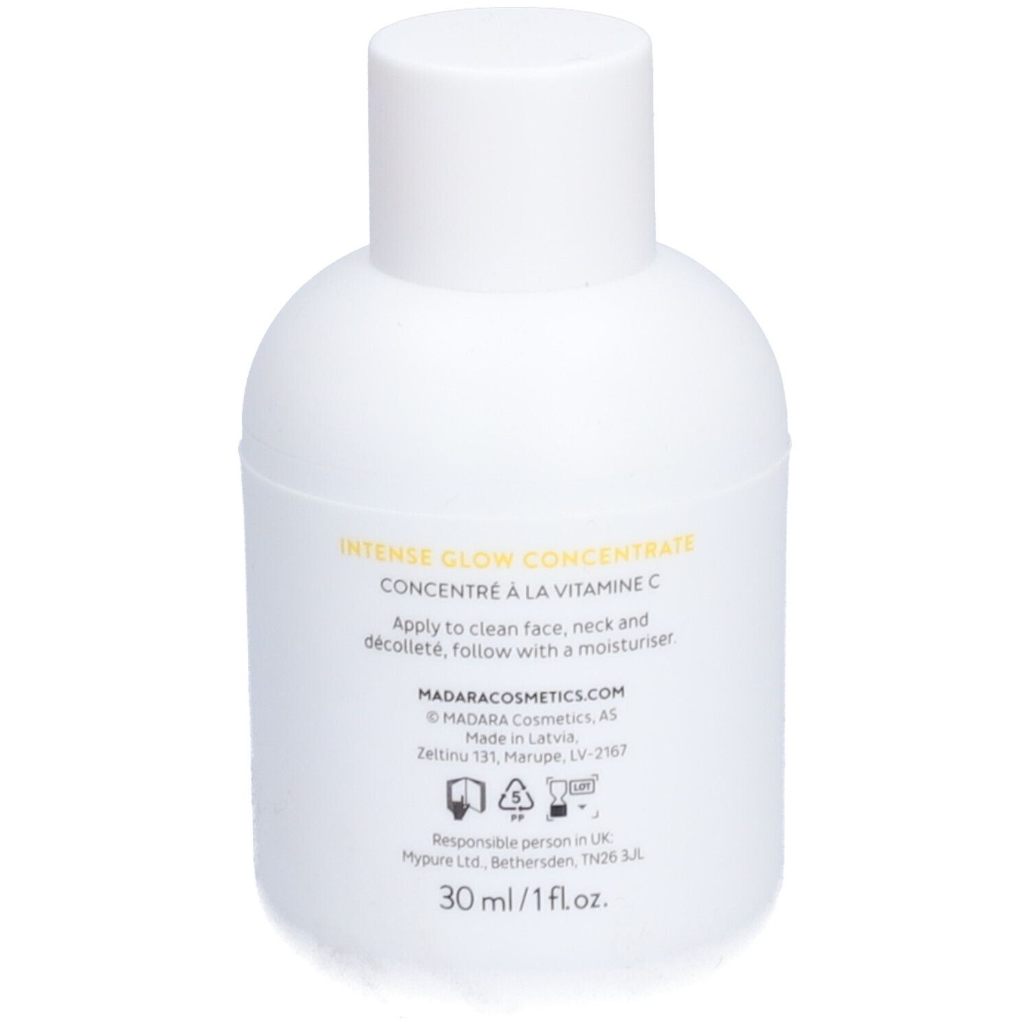 Weiße Flasche mit Text. Aufschrift: Intense Glow Concentrate, 30 ml/1 fl.oz. Adresse des Herstellers. Recycling-Symbole.