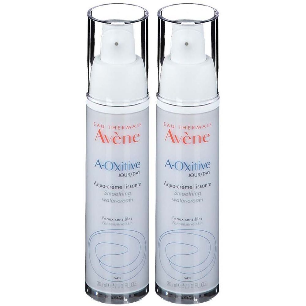 Deux flacons de crème Avène A-Oxitive. Flacons blancs avec pompe et capuchon transparent. Inscription : A-Oxitive, Aqua-crème lissante.