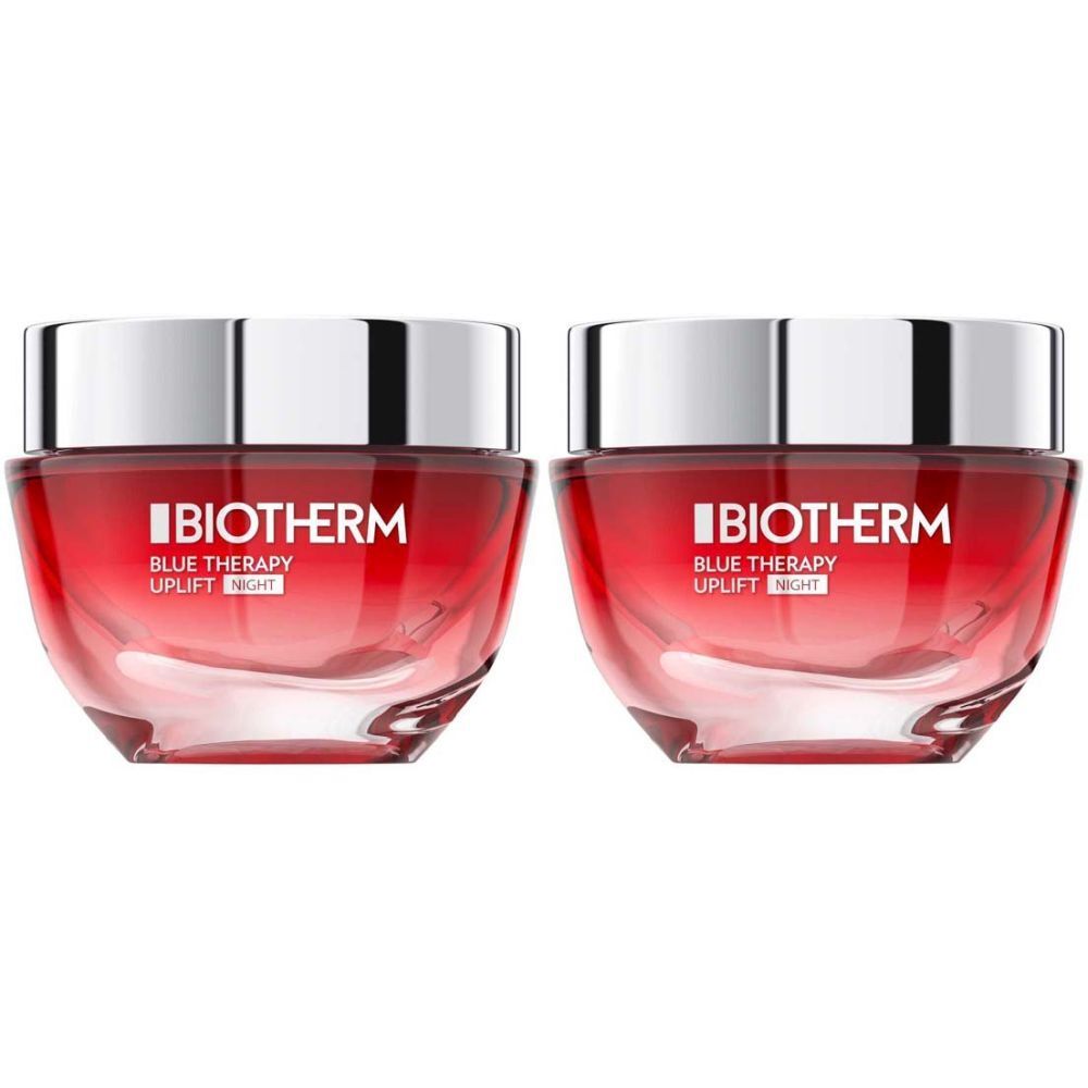 Zwei Tiegel BIOTHERM BLUE THERAPY Red Algae Uplift Nachtcreme. Rote, transparente Gläser mit silbernen Deckeln. Schriftzug auf der Vorderseite.