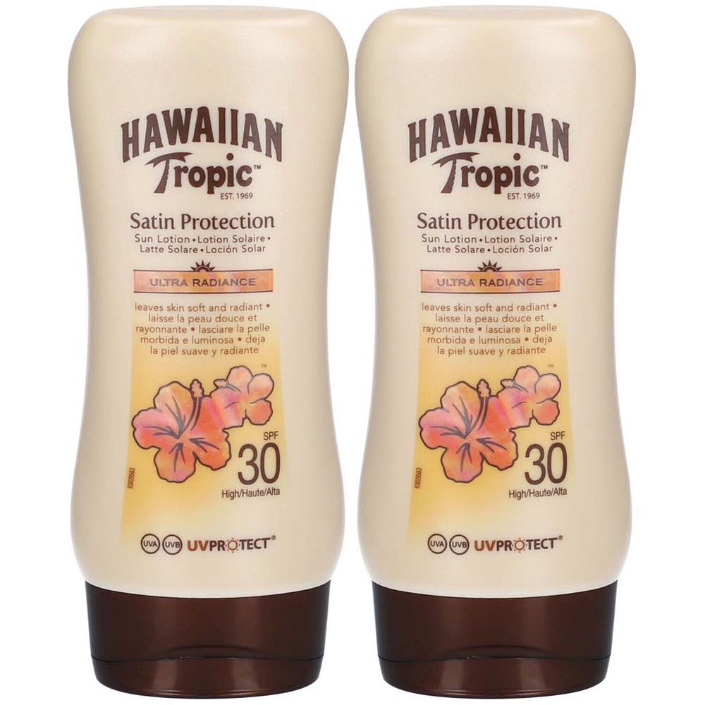 Zwei Flaschen HAWAIIAN Tropic Sonnenschutzlotion SPF30. Beige Flaschen mit braunen Deckeln. Text und Logo sind sichtbar.