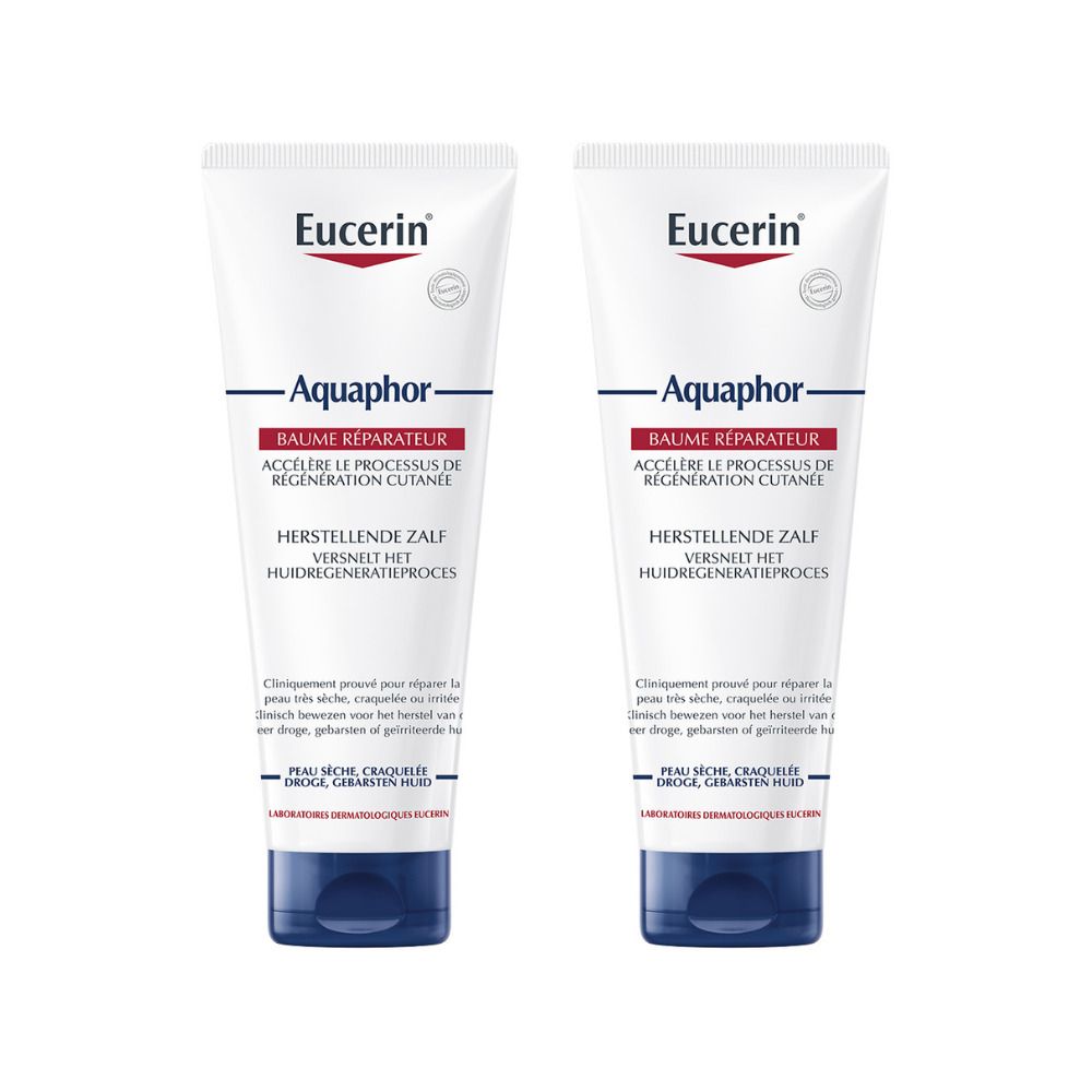 Zwei Tuben Eucerin Aquaphor Balsam. Weiß, mit blauer Kappe. Text: Aquaphor, Baume Réparateur, Herstellende Zalf.