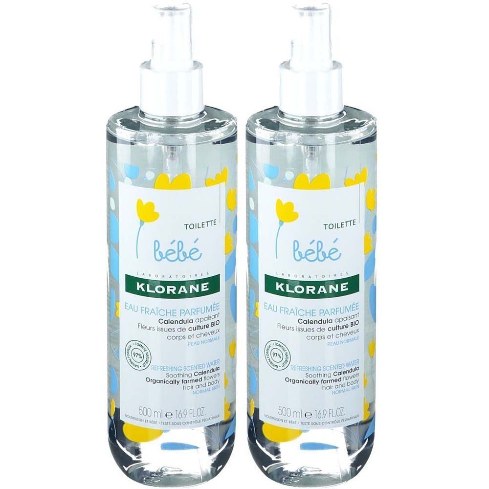 Deux flacons spray transparents avec tête blanche. Étiquettes avec texte et fleurs jaunes. Inscription: KLORANE Bébé.