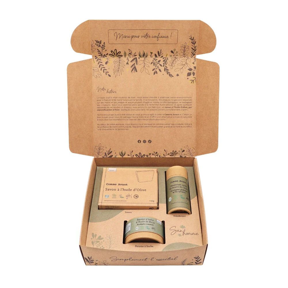 Geöffnete Geschenkbox "Comme Avant Soin Homme" mit Produkten. Enthält Seife, Deodorant und Bartbalsam. Braune Verpackung.