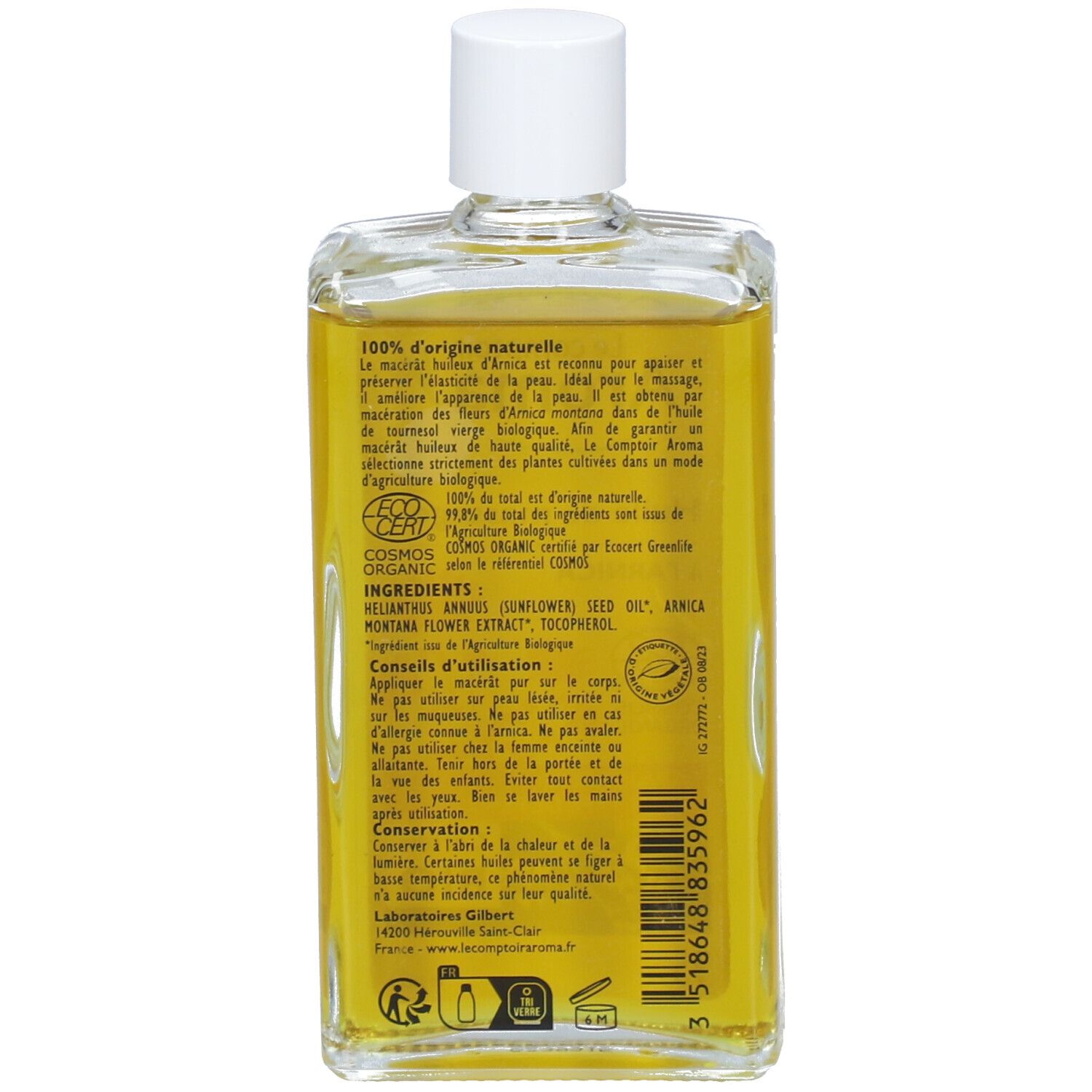 Achterkant van de oliefles. Tekst: 100% natuurlijke oorsprong, ingrediënten, gebruiksaanwijzing, bewaring. Bio-certificering.