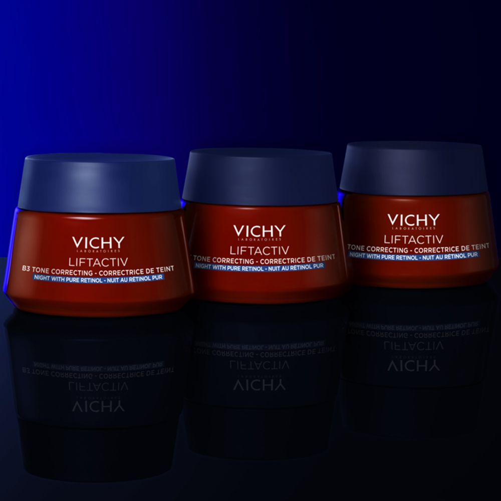 Trois pots rouges avec couvercles bleus. Texte : VICHY LIFTACTIV, B3 Tone Correcting. Sur fond sombre.