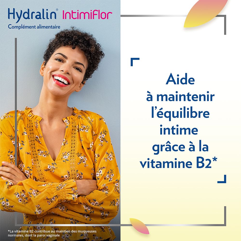 Femme avec haut jaune. Texte: Aide à maintenir l'équilibre intime grâce à la vitamine B2.