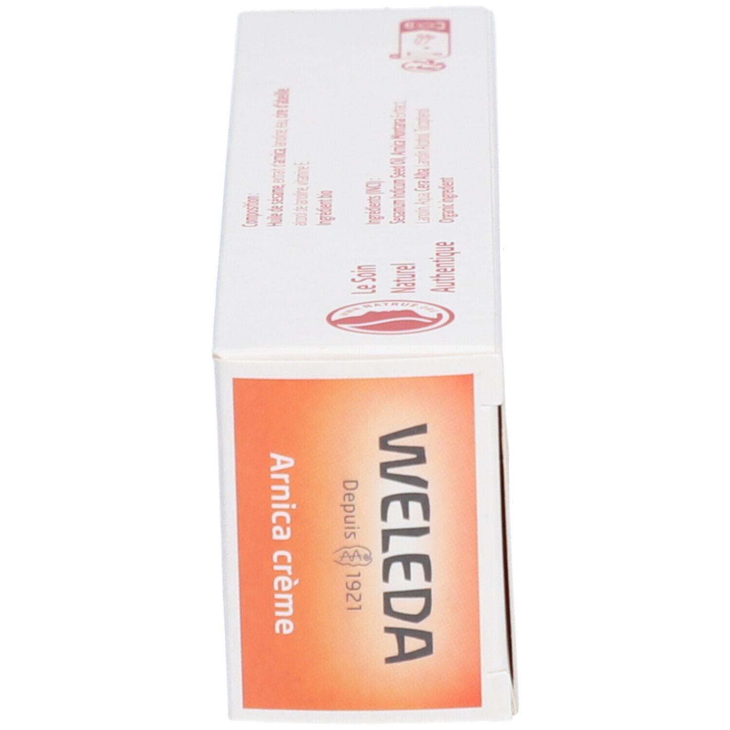 Schachtel, Seitenansicht. Aufschrift: Arnica crème, WELEDA.