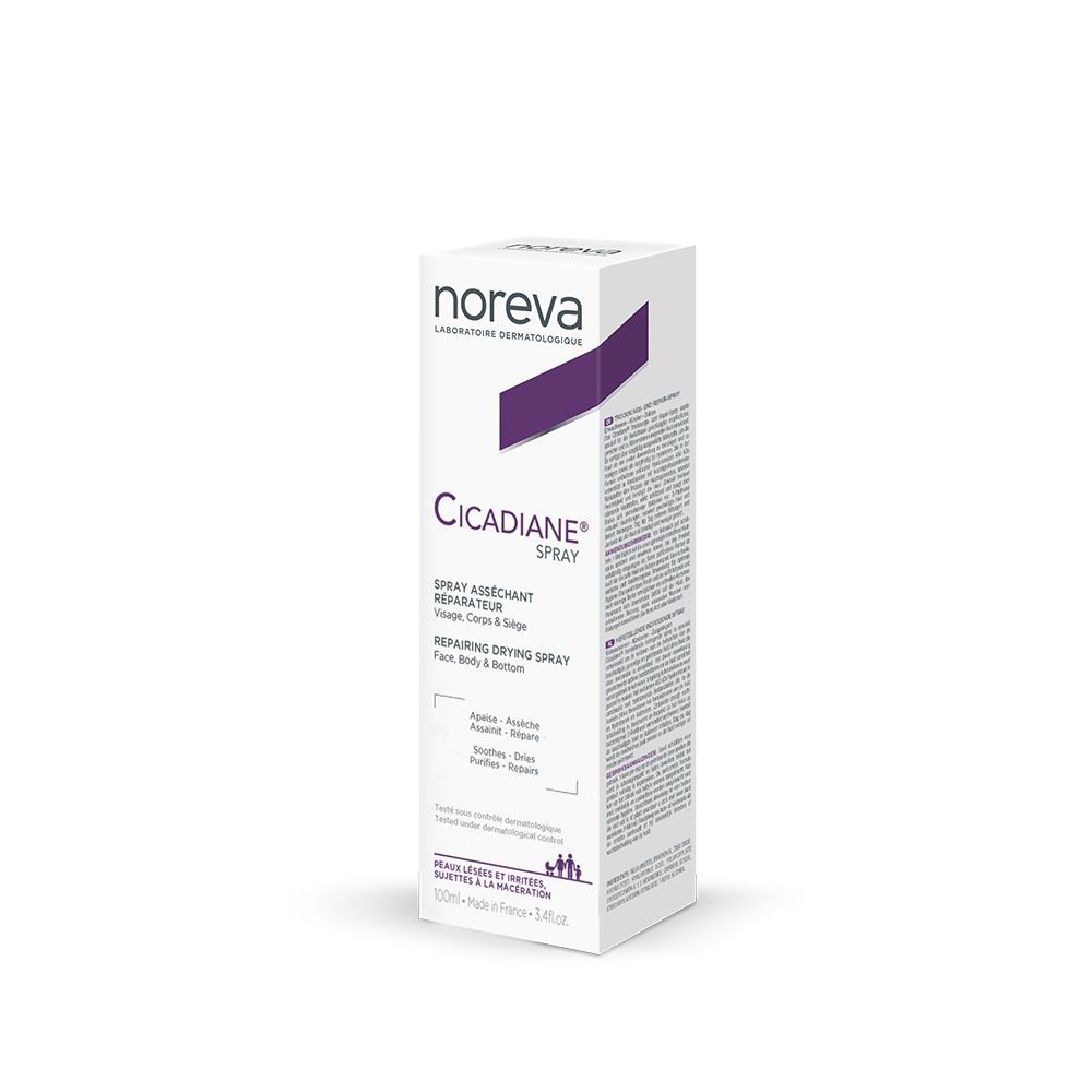 Emballage blanc avec accents violets. Inscription : Cicadiane Spray. Produit pour visage, corps et siège.