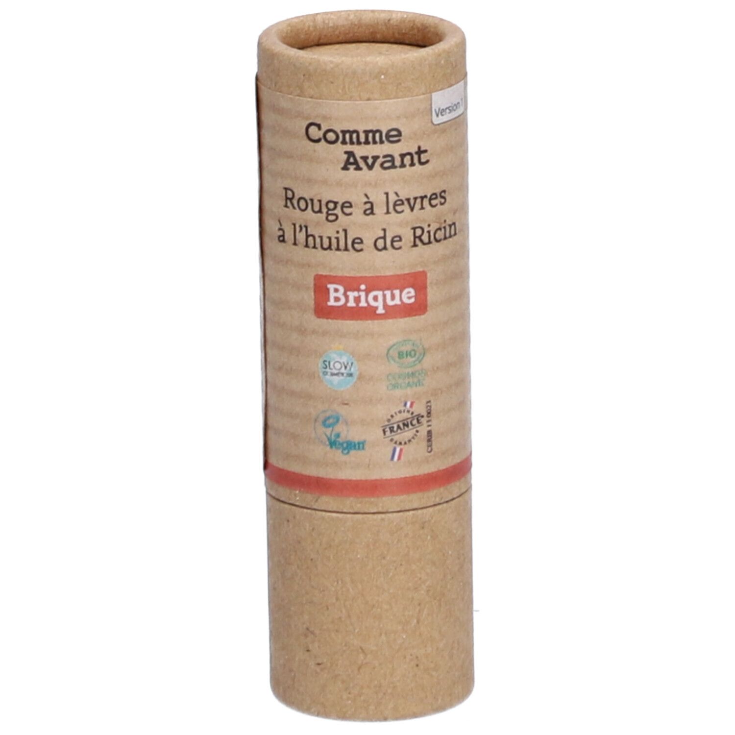 Zylindrische Verpackung. Aufschrift: Comme Avant, Rouge à lèvres à l'huile de Ricin, Brique. Logos: Bio, Vegan, Cosmos Organic, France.