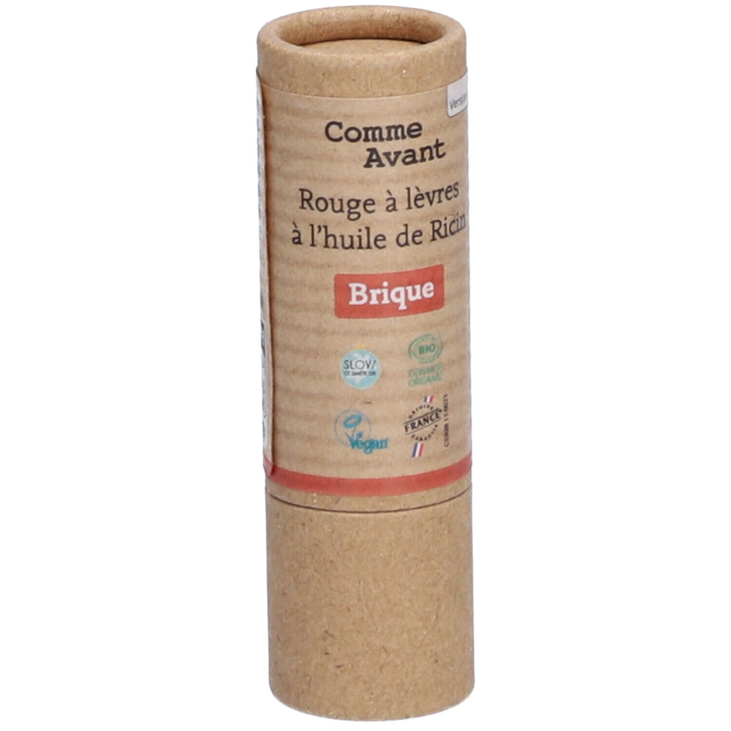 Zylindrische Verpackung. Aufschrift: Comme Avant, Rouge à lèvres à l'huile de Ricin, Brique. Logos: Bio, Vegan, Cosmos Organic, France.