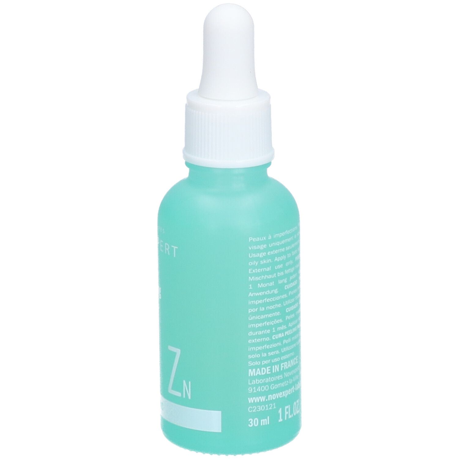 Flacon turquoise avec compte-gouttes blanc. Inscription : Novexpert, 30 ml, 1 FL.OZ.