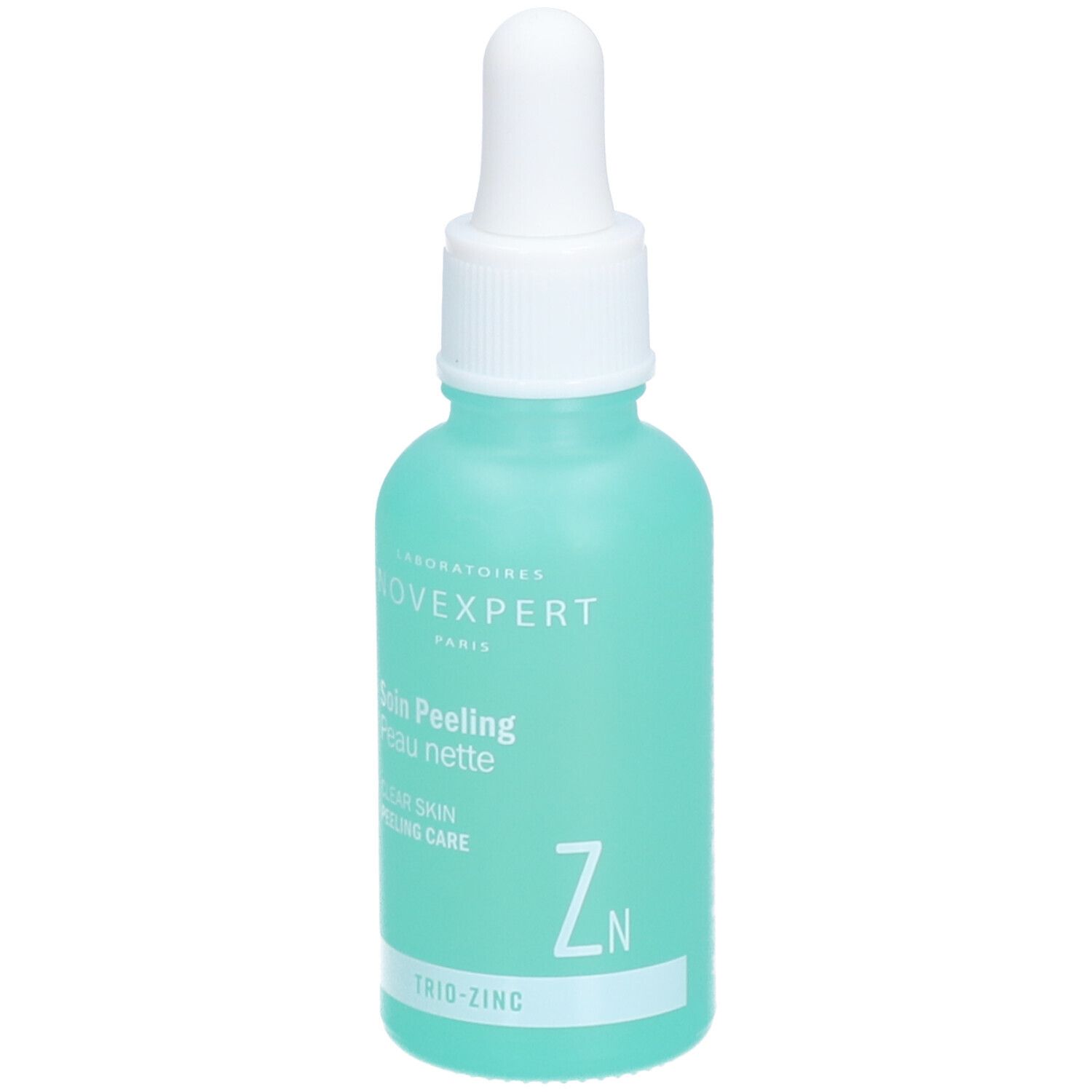 Flacon turquoise avec compte-gouttes blanc. Inscription : Novexpert, Soin Peeling Peau nette, Clear Skin Peeling Care, Trio-Zinc.