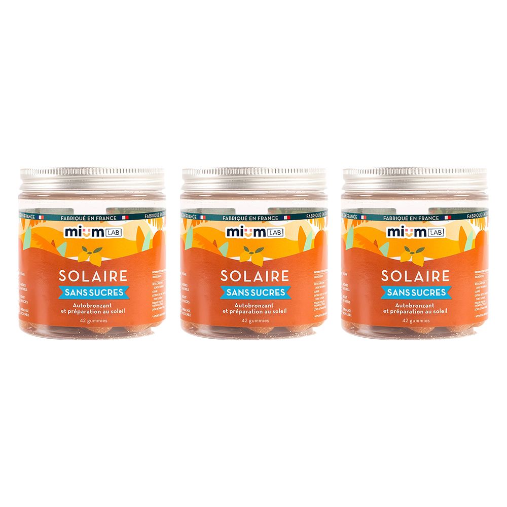 Trois pots de gummies orange. Inscription Solaire, Sans Sucres. Marque mium lab. Couvercles métalliques.