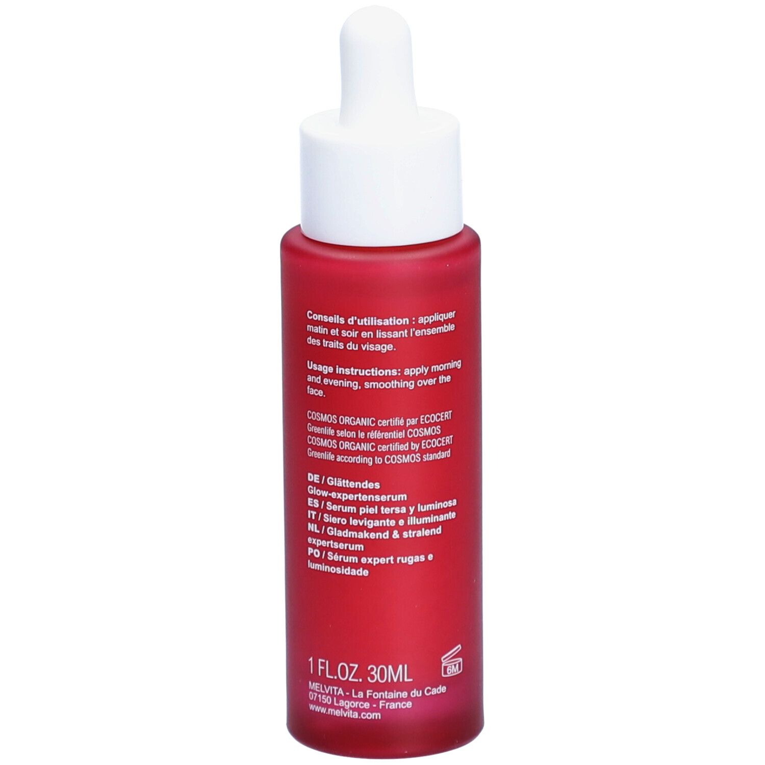 Flacon rouge avec bouchon blanc et pipette. Inscription : Melvita, Argan Bio-Active Sérum. Texte au dos.