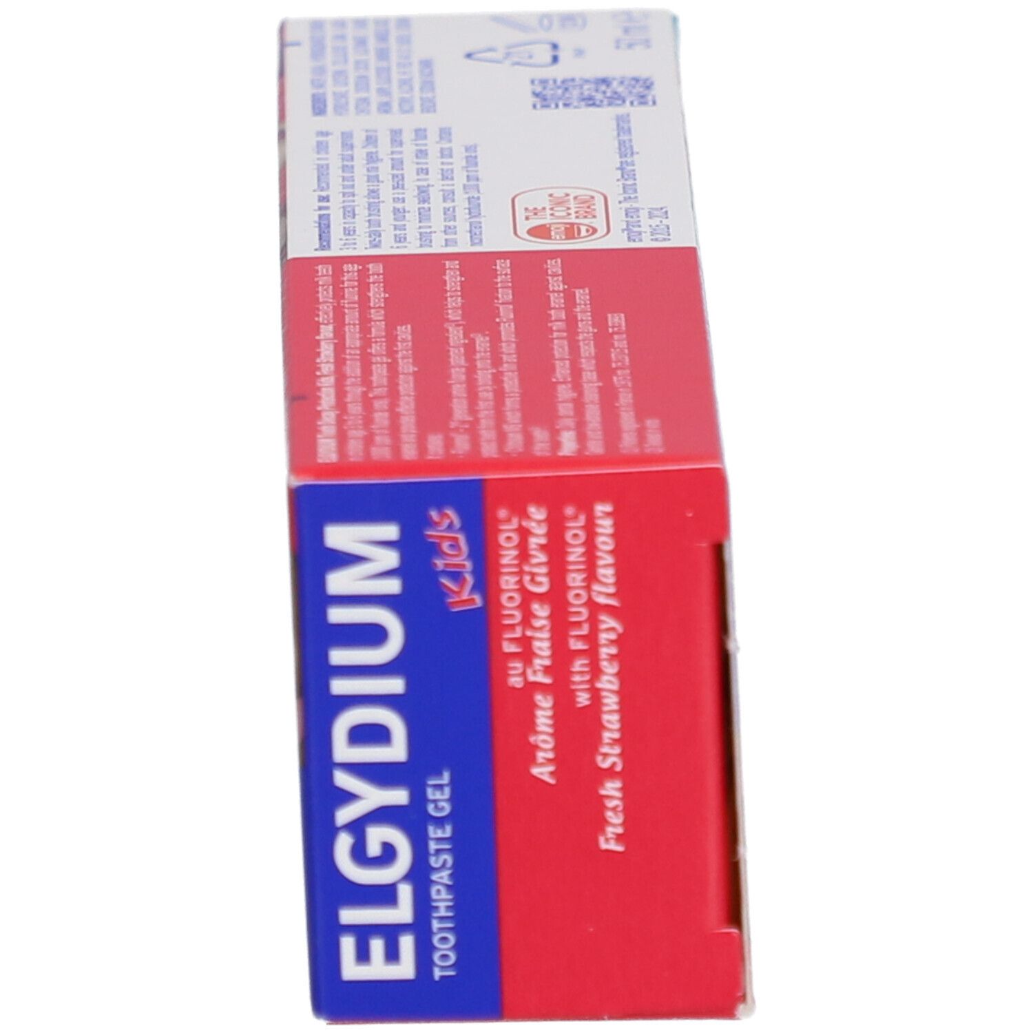 Vue latérale de l'emballage du dentifrice. Affiche le nom du produit, les ingrédients et les informations du fabricant. Goût fraise.
