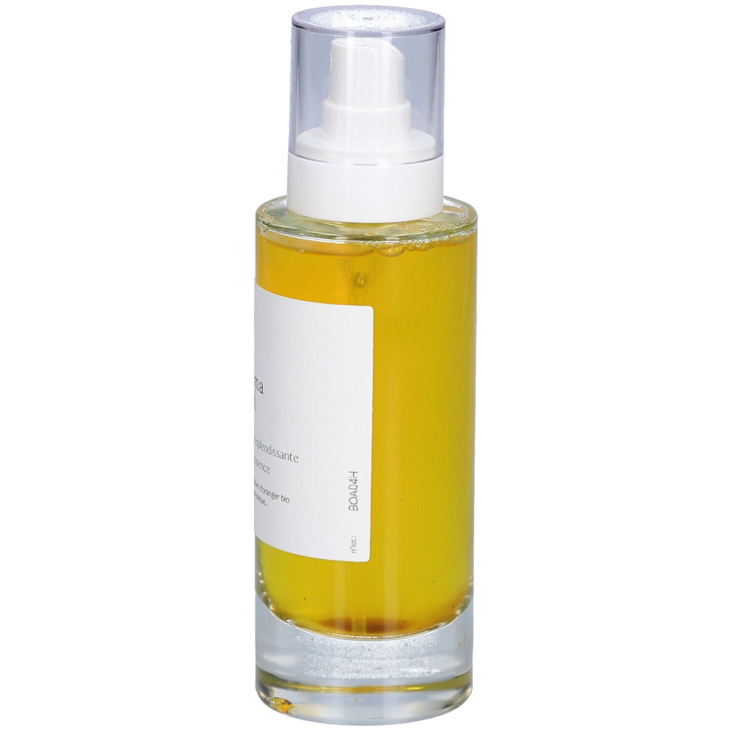 Glazen fles met gele vloeistof en verstuiver. Opschrift: minima liste. Essence resplendissante, Glowing essence.