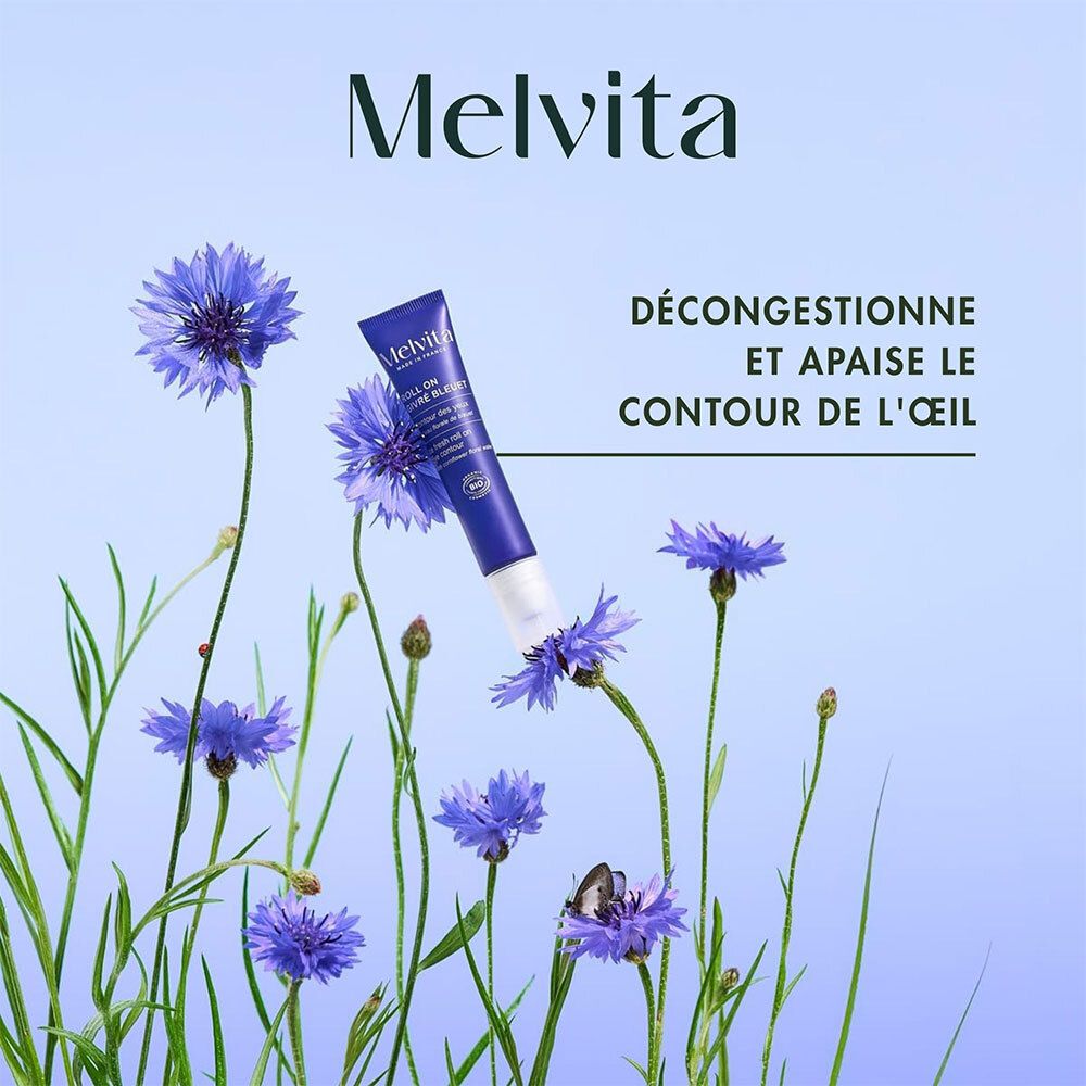 Melvita Roll-On mit Kornblumenwasser zwischen Kornblumen.