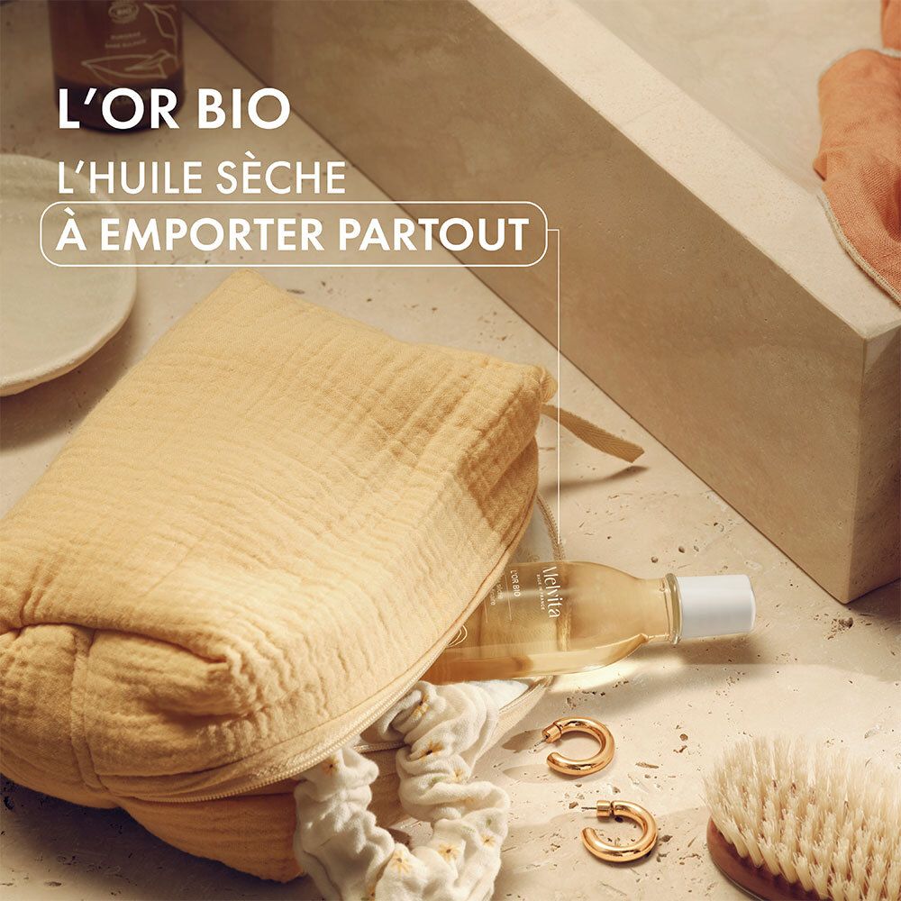Melvita L'Or Bio Ölflasche in einer Tasche. Weitere Produkte und Accessoires.