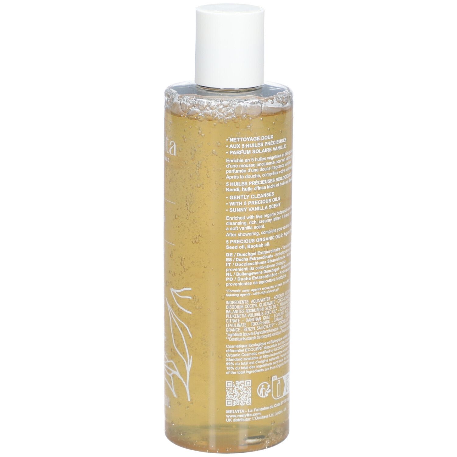 Rückseite der Melvita L'Or Bio Gel Douche Extraordinaire Flasche. Text, Inhaltsstoffe und Logos auf transparentem Behälter.