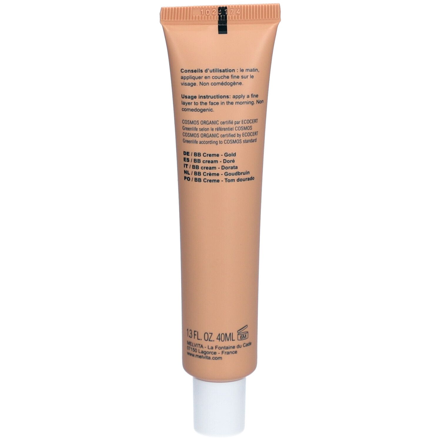 Dos d'un tube beige. Texte: Conseils d'utilisation, ingrédients, BB Crème Doré, 40ml, COSMOS ORGANIC.