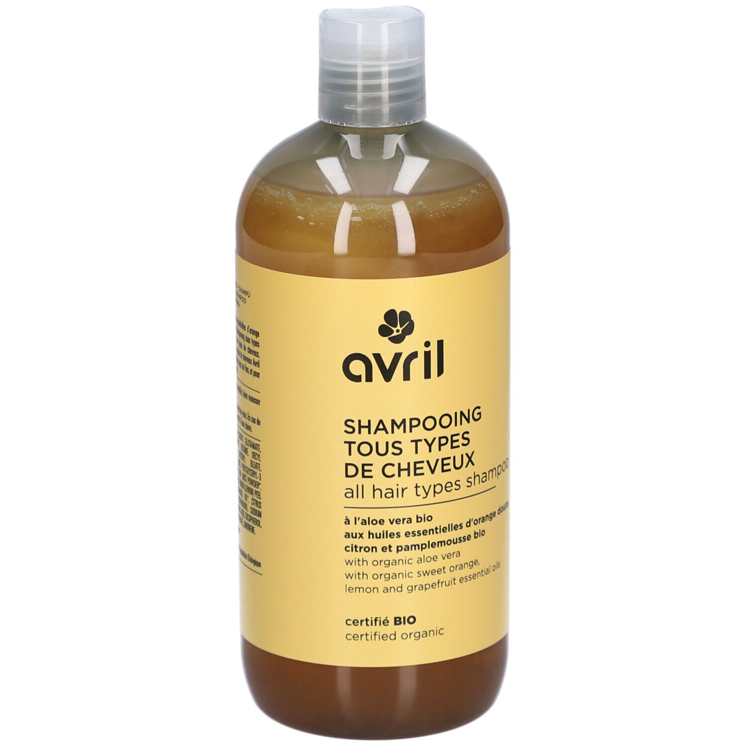 Flacon jaune Avril, Shampooing Tous Types de Cheveux. Ingrédients bio. Bouchon blanc et liquide ambré.