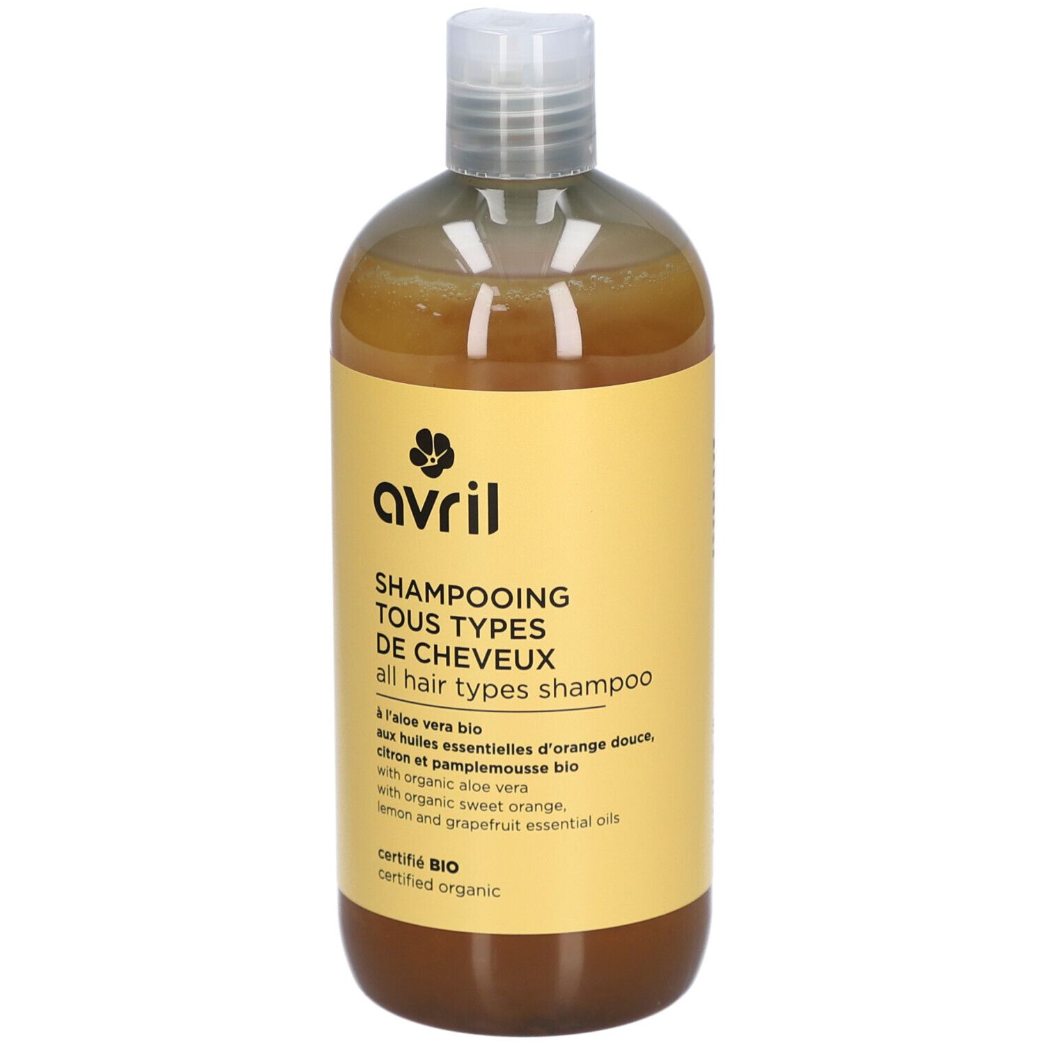 Flacon jaune Avril, Shampooing Tous Types de Cheveux. Ingrédients bio. Bouchon blanc et liquide ambré.