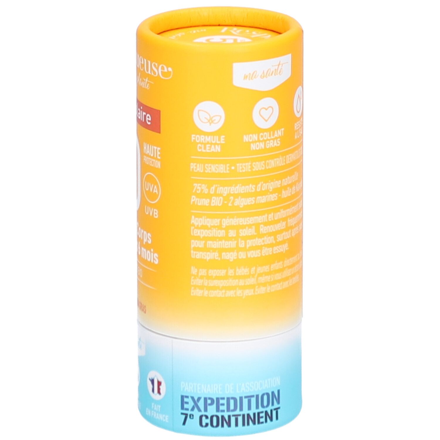 Zylindrischer Sonnencreme-Stick. Gelb-orangefarbene Verpackung mit Produktinformationen. Formel, 75% natürliche Inhaltsstoffe, Expedition 7. Kontinent.