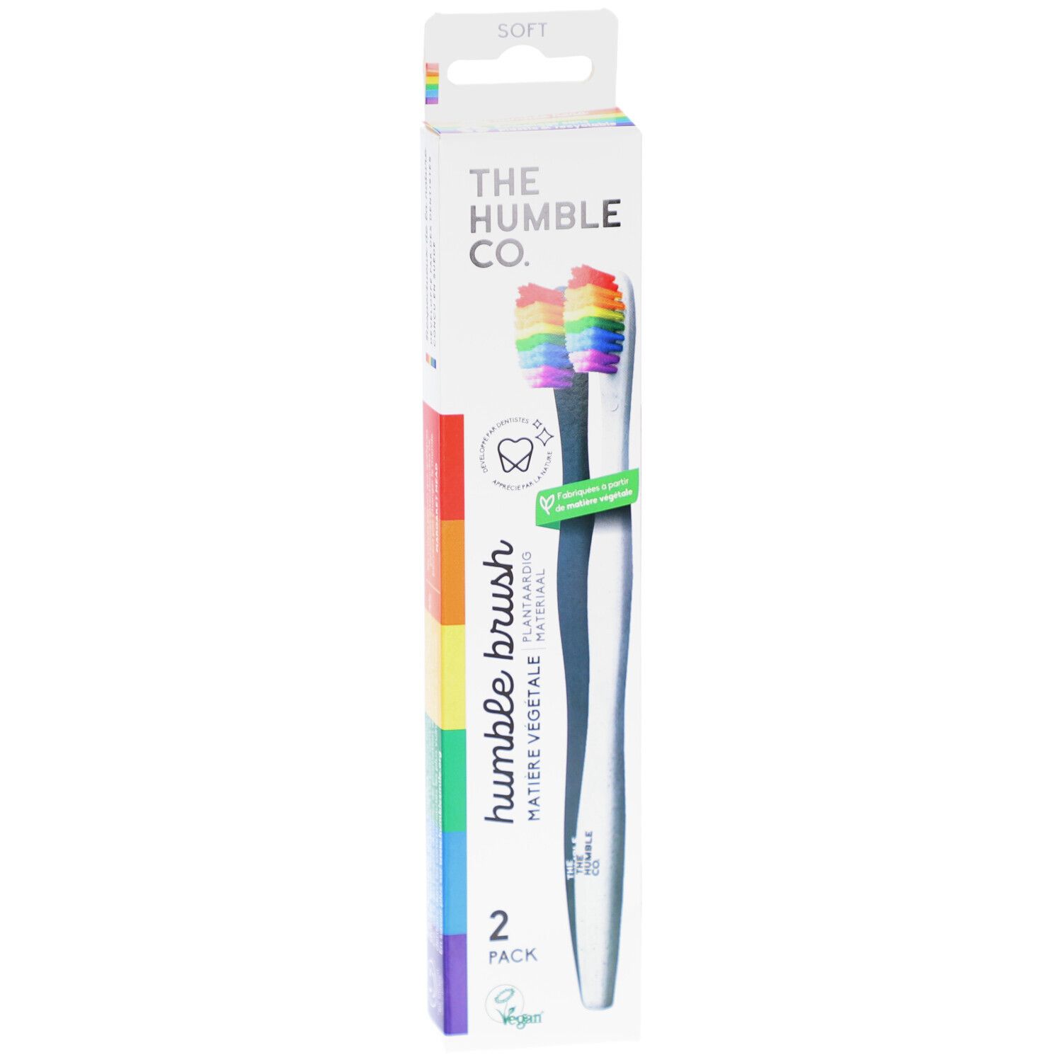 Zahnbürsten-Packung mit zwei Bürsten. Regenbogenfarbene Borsten, weißer Griff. Marke: The Humble Co.