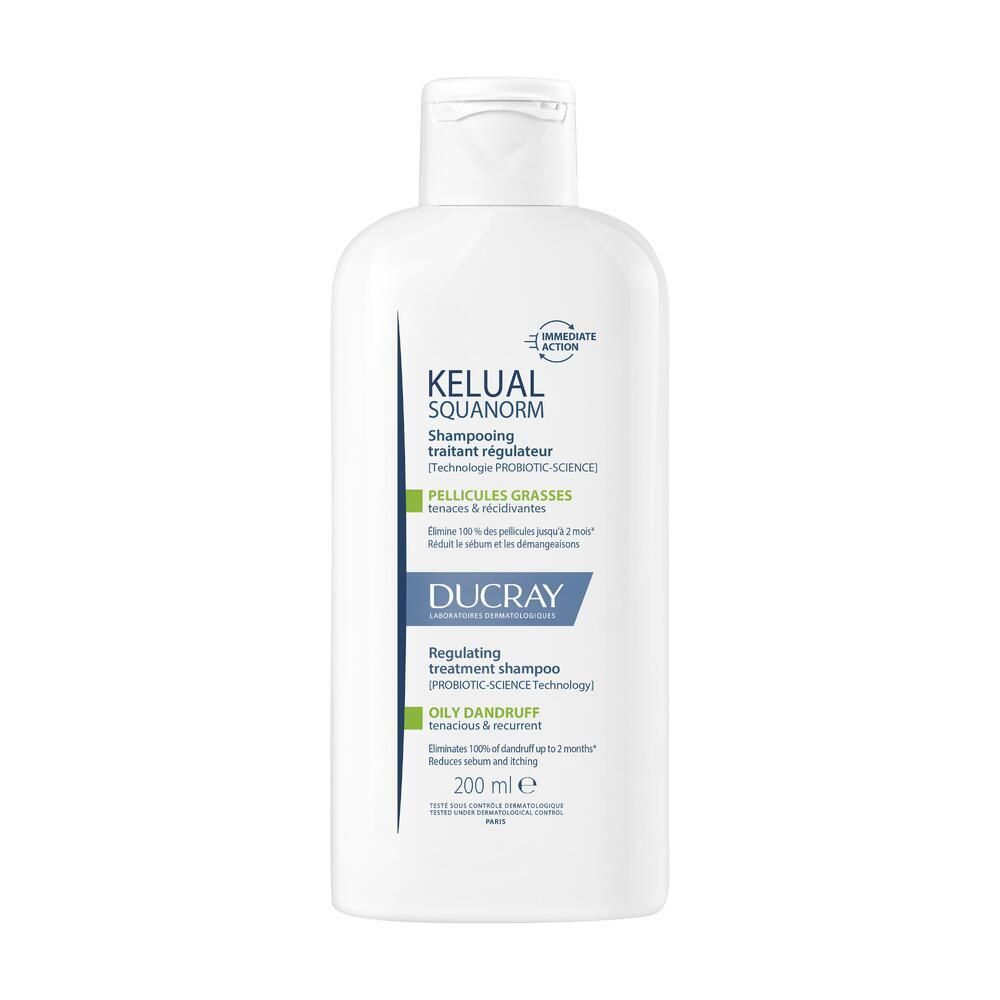 Flacon blanc avec étiquette bleu et blanc. Shampooing Kelual Squanorm, 200 ml. Logo Ducray. Pour pellicules grasses.
