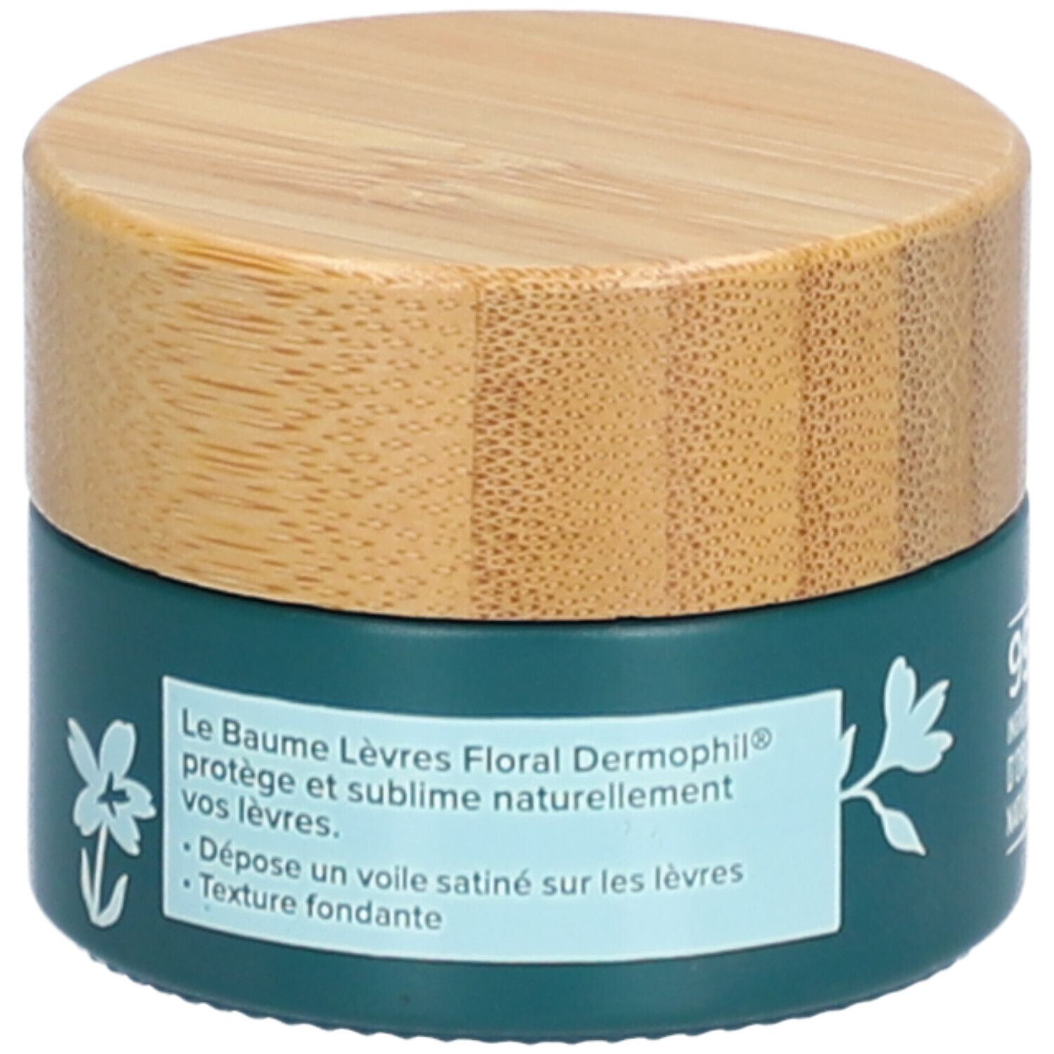 Dunkelgrüner Tiegel mit Holzdeckel. Text: Le Baume Lèvres Floral Dermophil protège et sublime naturellement vos lèvres. Marke: dermophil.
