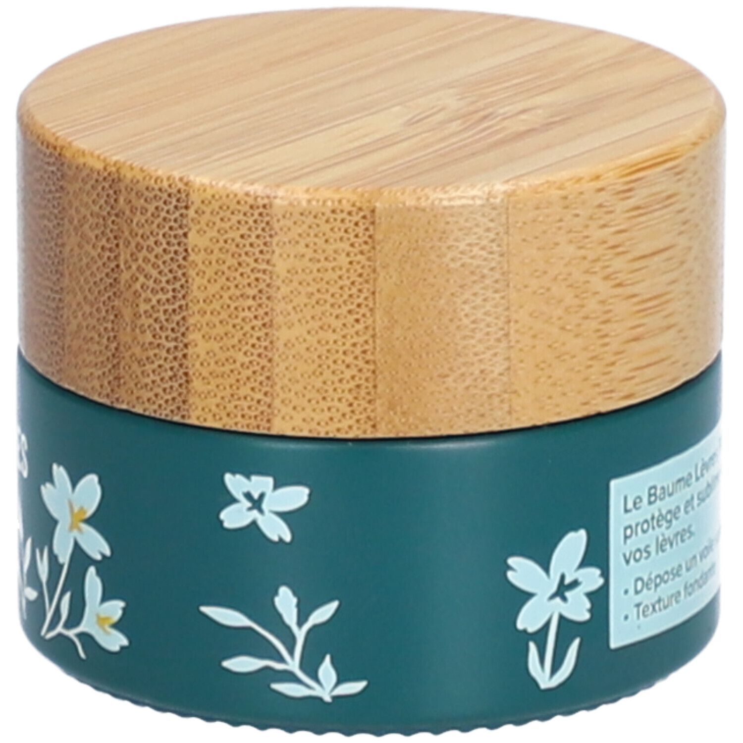 Dunkelgrüner Tiegel mit Holzdeckel. Text: Le Baume Lèvres Floral protège et sublime vos lèvres. Weiße Blumenmuster. Marke: dermophil.