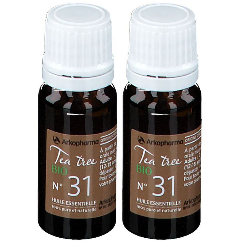 Deux flacons en verre brun avec des bouchons blancs. Étiquettes avec "Tea tree BIO" et "N° 31".