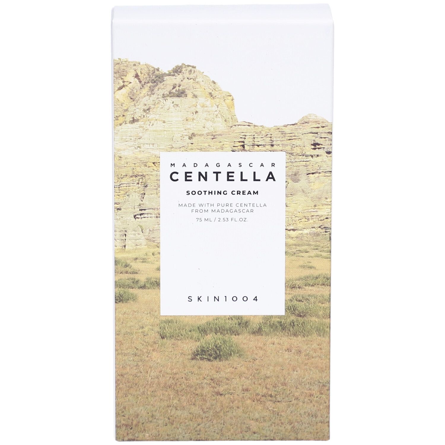 Weiße Verpackung mit Produktnamen und Landschaftsbild. Text: Madagascar Centella Soothing Cream, SKIN1004.
