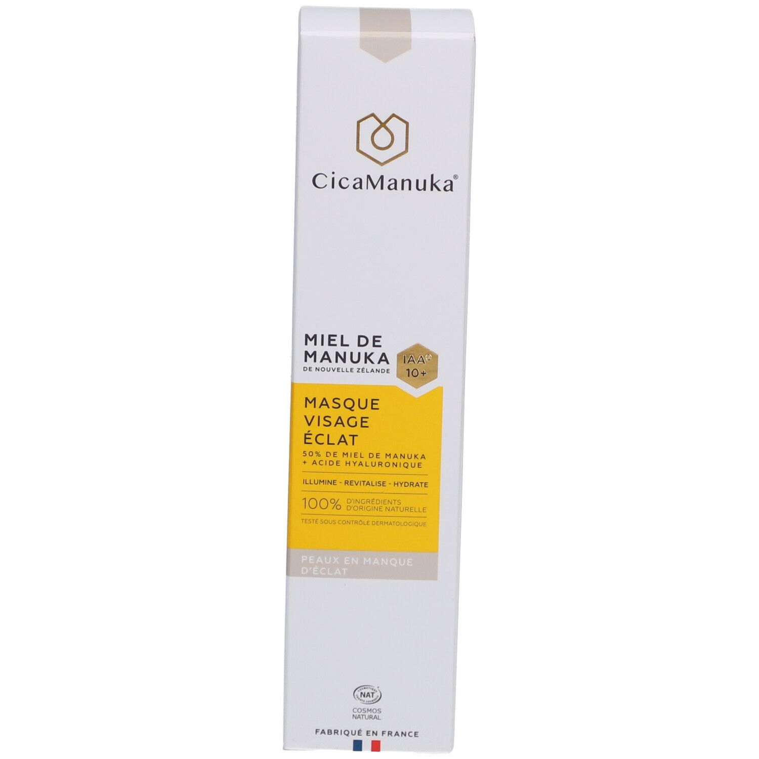 Boîte blanche avec étiquette jaune. Inscription : CicaManuka, Miel de Manuka, Masque Visage Éclat. Certification IAA10+. Fabriqué en France.