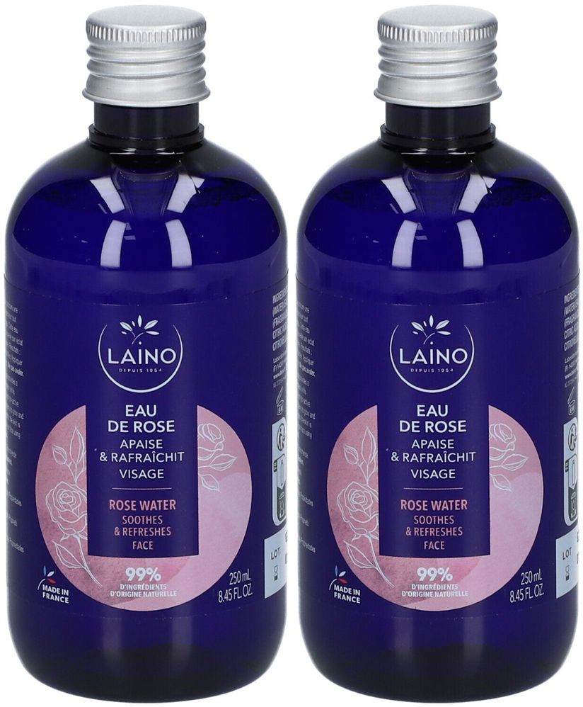 Zwei Flaschen LAINO Eau de Rose. Blaue Flaschen mit silbernem Deckel. Aufschrift: Eau de Rose, beruhigt und erfrischt das Gesicht. 99% natürlichen Ursprungs.