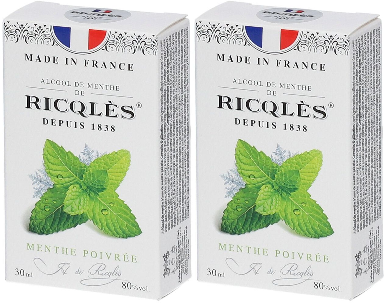Deux boîtes de produit. Inscription : Ricqlès, Alcool de Menthe, Menthe Poivrée. Drapeau français et illustration de feuilles de menthe.
