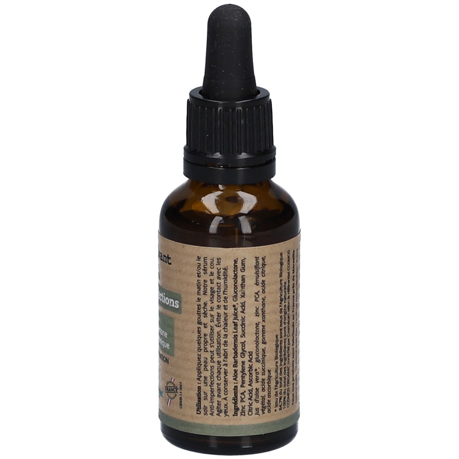 Bruine glazen fles met zwarte druppelaar. Achterkant met tekst over gebruik en ingrediënten. Vegan-logo.