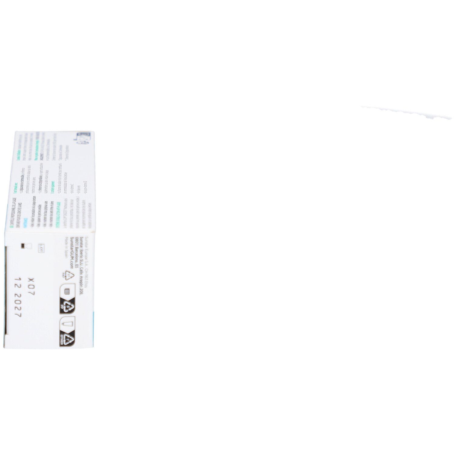 Emballage de dentifrice GUM Gingidex. Boîte blanche avec informations sur le produit et logo.