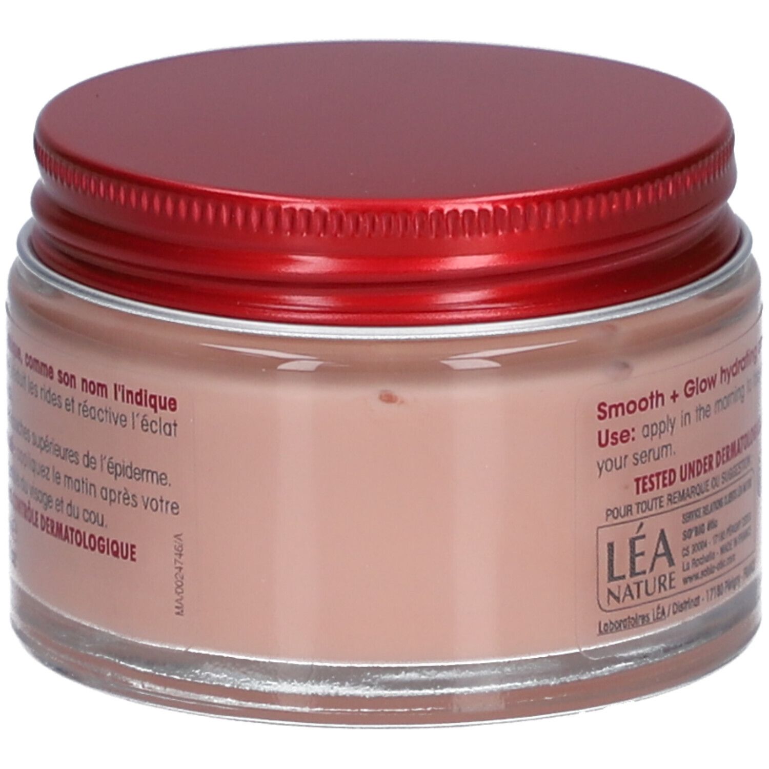 Crème en pot avec couvercle rouge. Inscription: Smooth + Glow hydrating cream. Testé sous contrôle dermatologique.