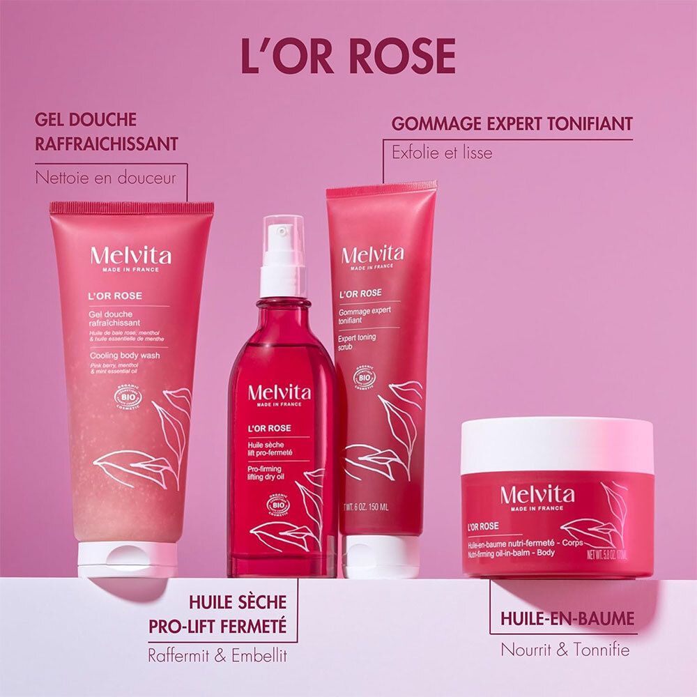 Vier Melvita L'Or Rose Produkte: Duschgel, Körperöl, Peeling und Körperbalsam in rosa Verpackungen.