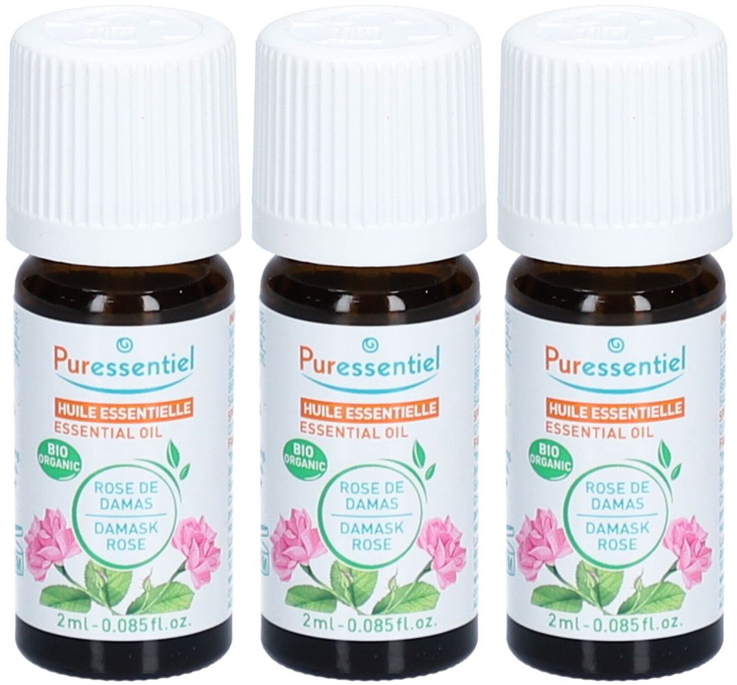Drei kleine Fläschchen mit weißem Deckel. Aufschrift: Puressentiel, ätherisches Öl, Rose de Damas. Bio-Zertifizierung.
