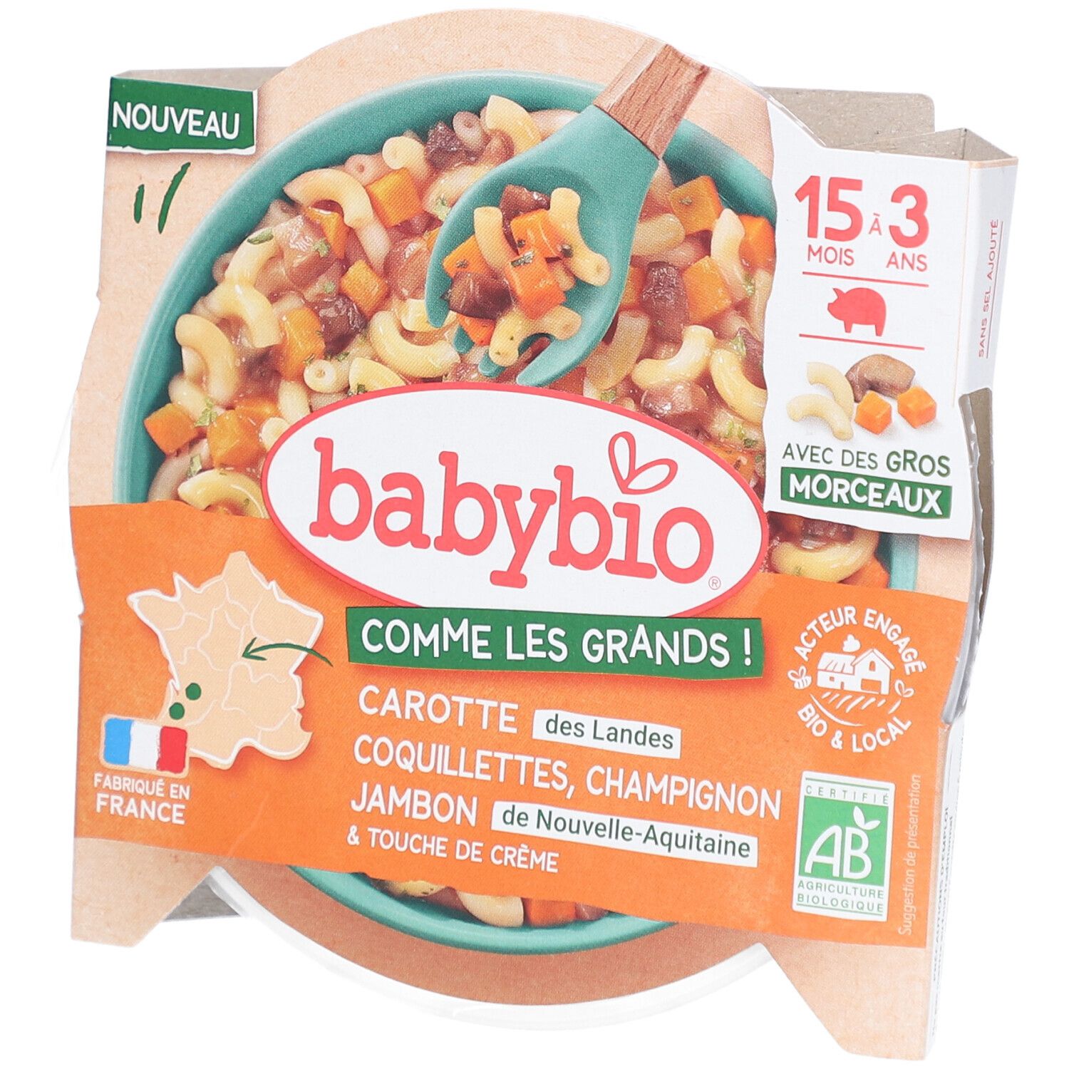 Fertiggericht für Babys. Marke Babybio. Enthält Karotten, Nudeln, Champignons, Schinken und Sahne. Verpackung mit Löffel.