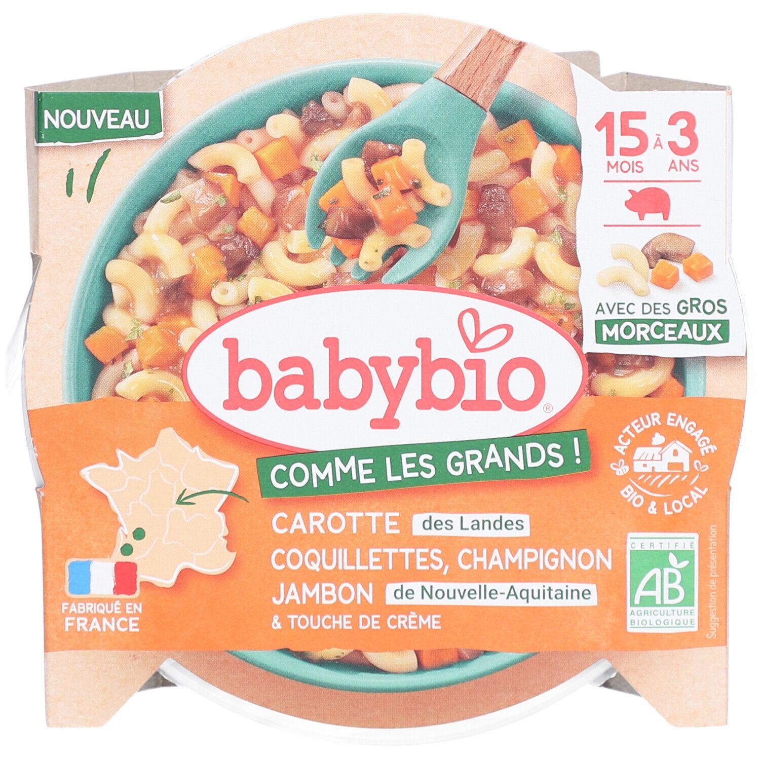 Babybio-Fertiggericht. Enthält Karotten, Nudeln, Champignons, Schinken und Sahne. Verpackung mit Löffel.