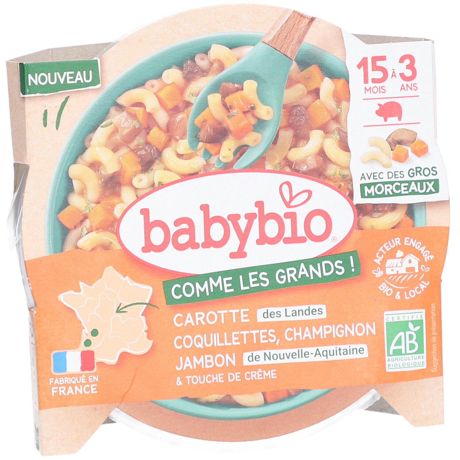 Babybio-Fertiggericht. Enthält Karotten, Nudeln, Champignons, Schinken und Sahne. Verpackung mit Löffel.
