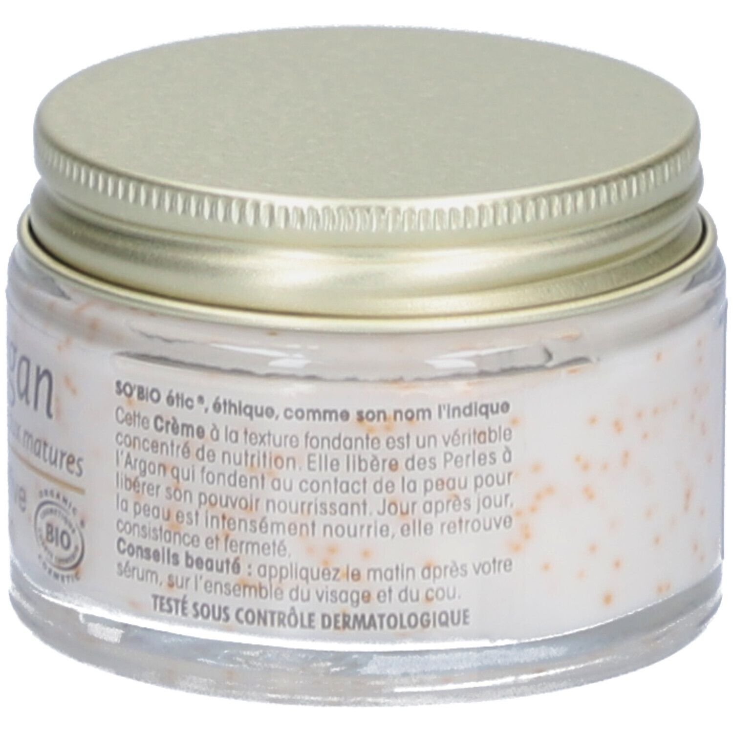 Pot de crème avec couvercle doré. Inscription: SO BIO étic. Crème avec perles. Logo cosmétique bio. Texte en français.