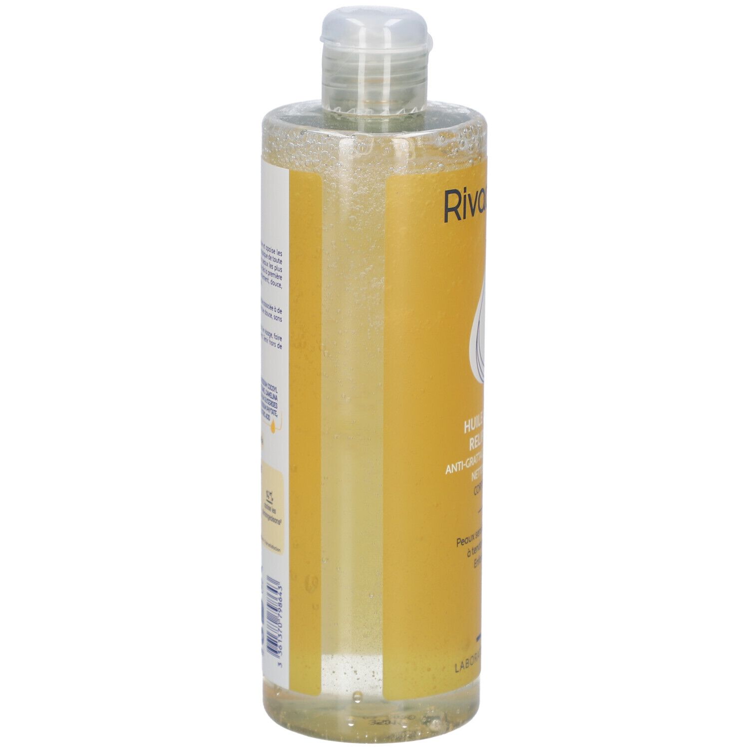 Flacon transparent avec étiquette jaune. Inscription: Rivadouce, Huile lavante relipidante. Vue latérale avec informations et ingrédients.