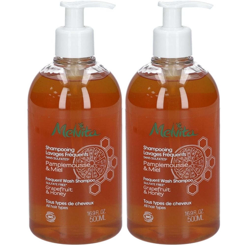 Zwei Flaschen Shampoo mit Pumpverschluss. Aufschrift: Melvita, Shampooing Lavages Fréquents, Pamplemousse & Miel, 16.9 fl oz, 500ml.