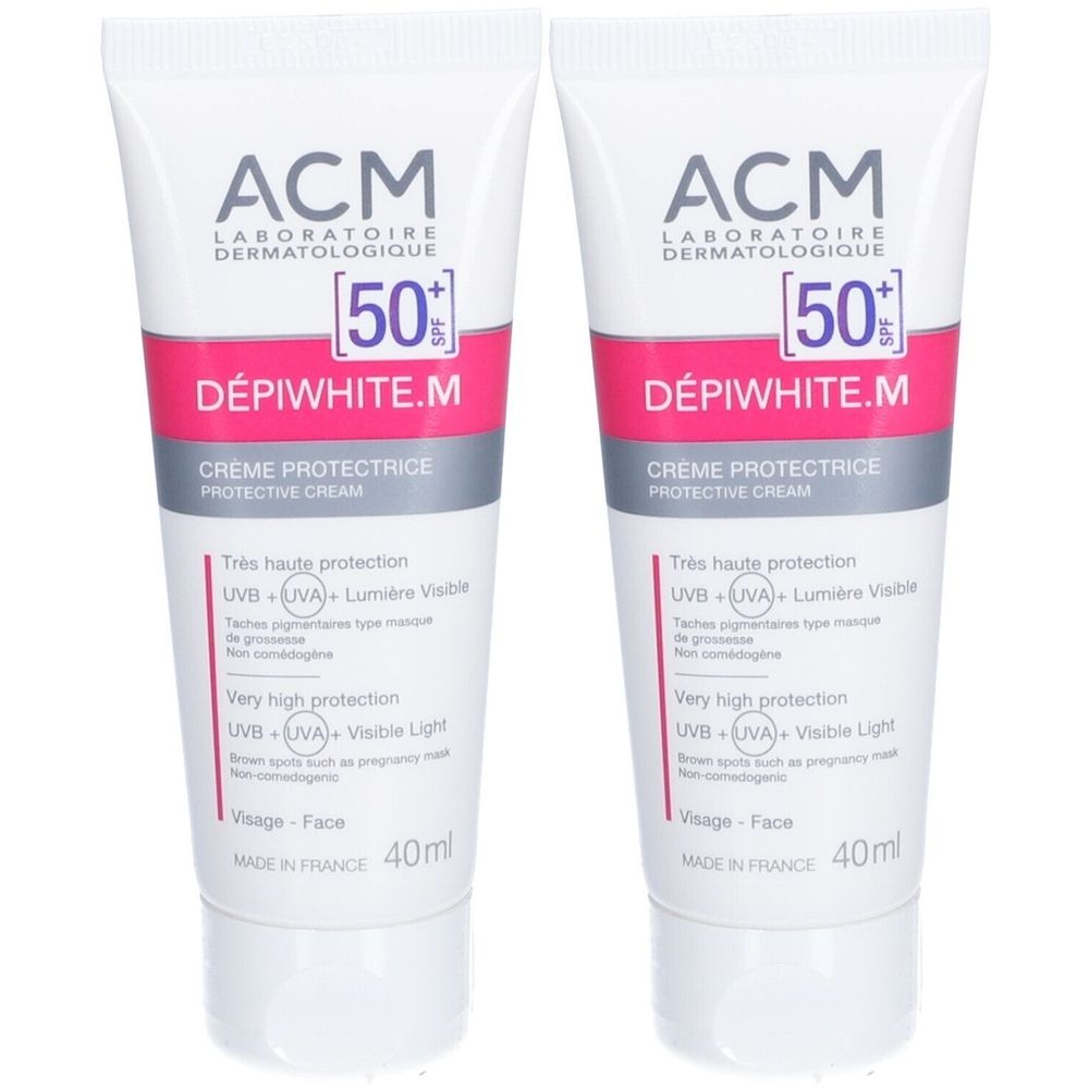Zwei Tuben Creme mit Aufschrift "ACM DÉPIWHITE.M". Weiß, pink und grau. Mit SPF 50+.
