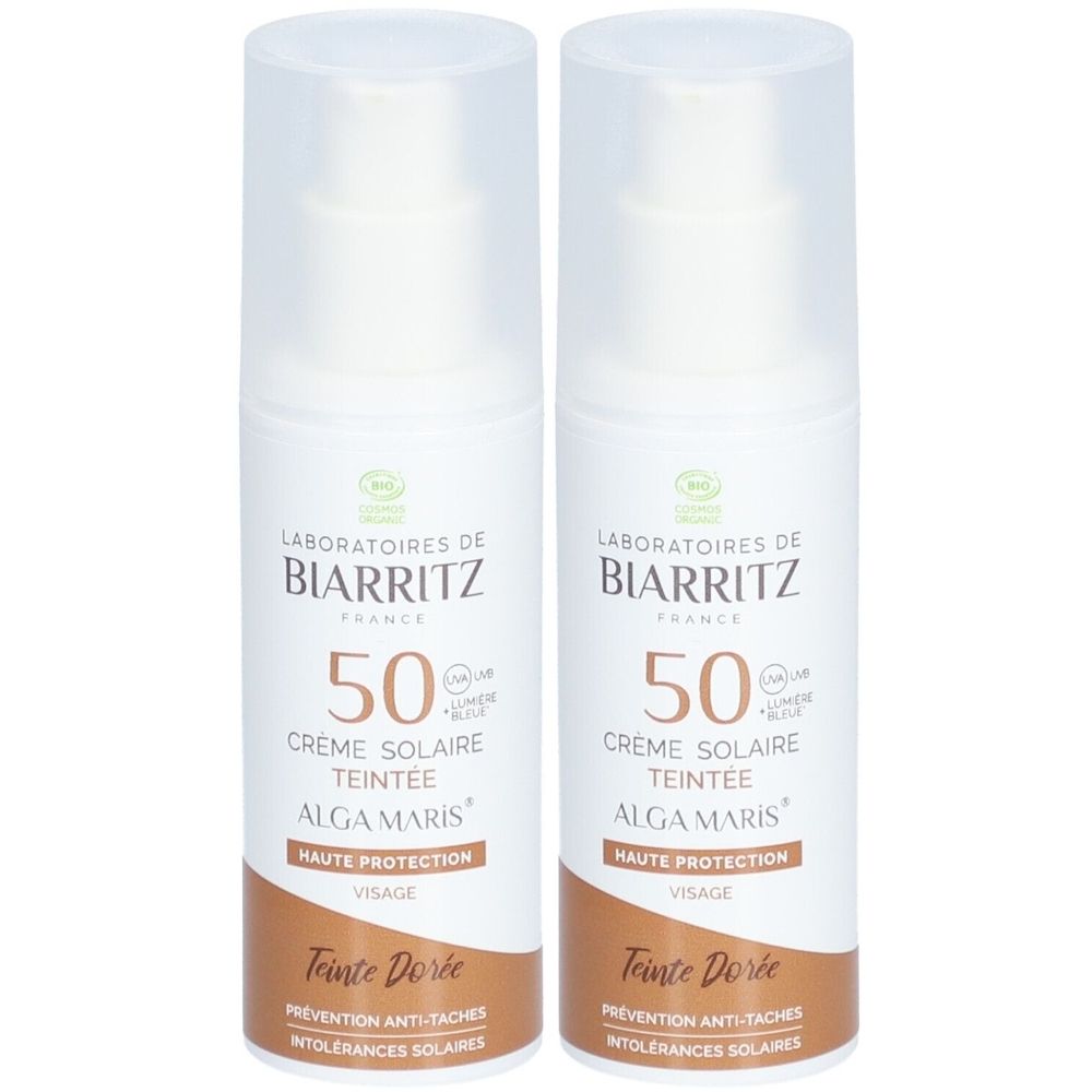 Zwei Flaschen Sonnencreme mit weißem Körper und braunem Boden. Aufschrift: Laboratoires de Biarritz, 50, Crème Solaire Teintée.